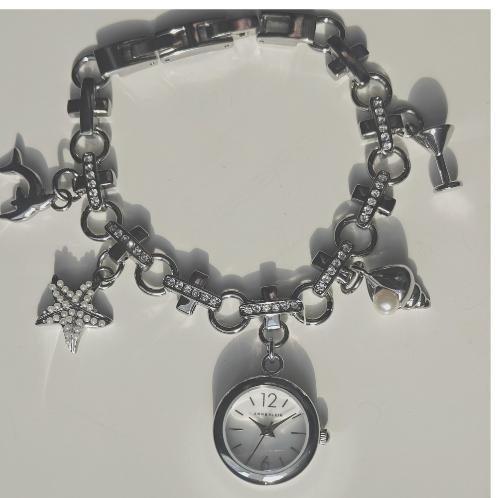 Anne Klein Silver Tone Beachy Charm Bracelet Watch Dolphin Starfish Seashell